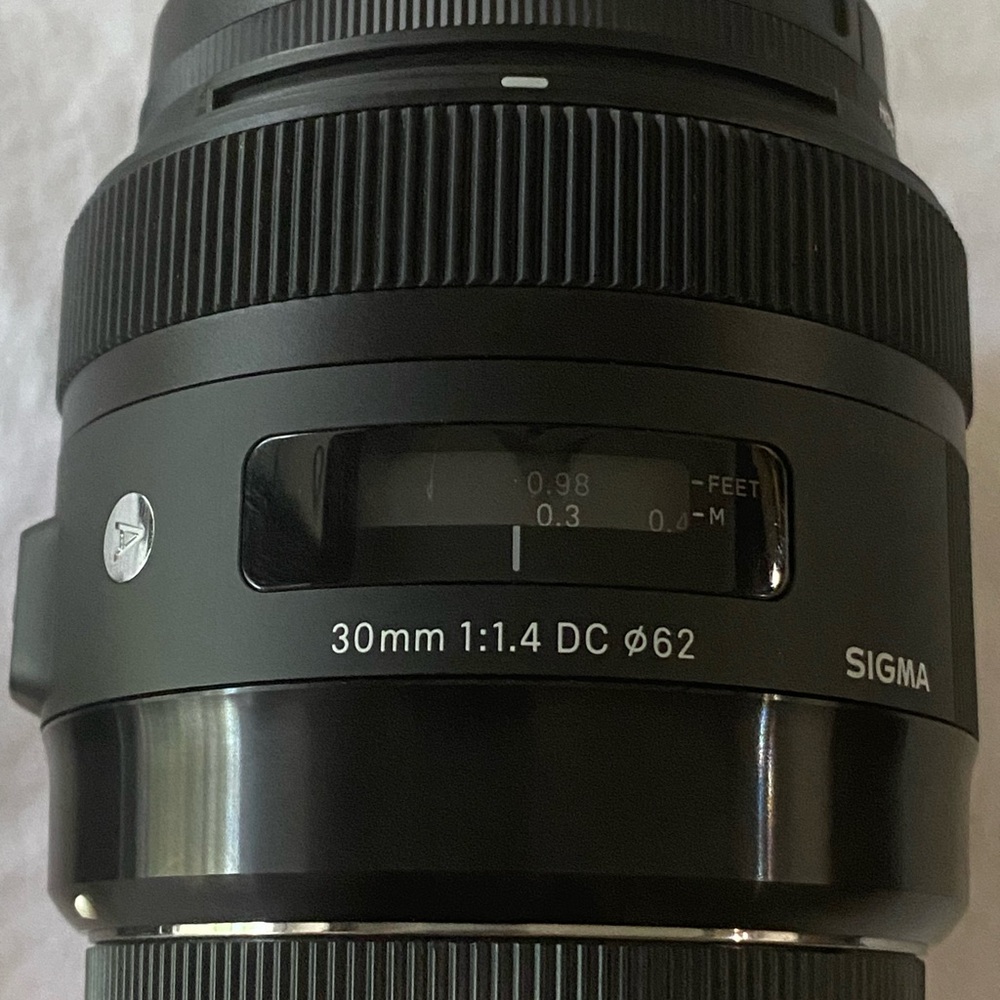 Sigma 30 mm 1.4 DC camera lens for Canon
